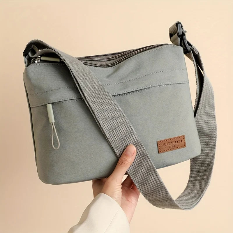 Stilvolle Crossbody Handtasche mit Reißverschluss mit Innenfächern