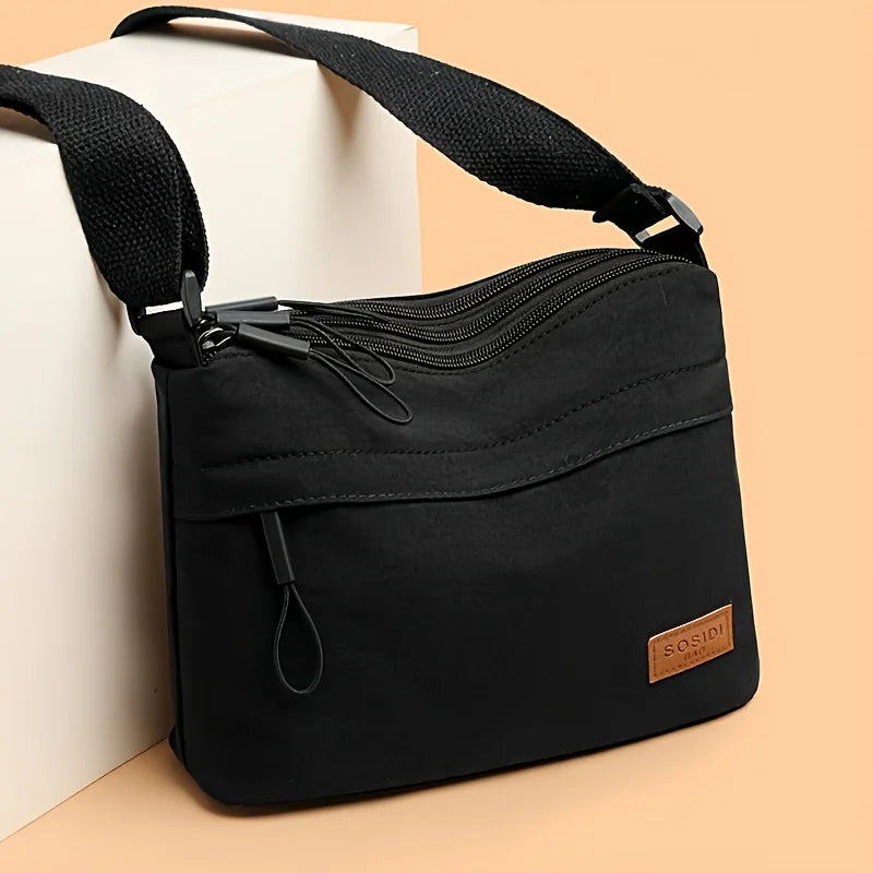 Stilvolle Crossbody Handtasche mit Reißverschluss mit Innenfächern