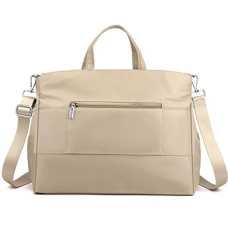 Stylish shopper in leather look with zipper and inner compartments