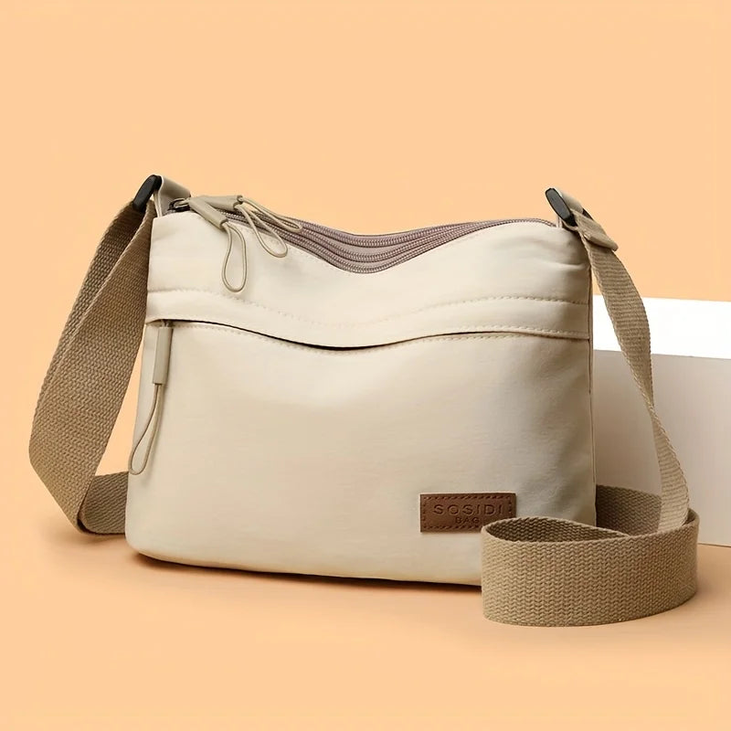 Stilvolle Crossbody Handtasche mit Reißverschluss mit Innenfächern